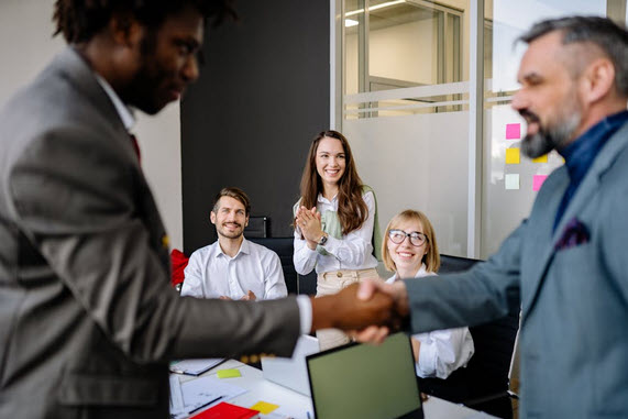 A team celebrating a milestone in a modern office